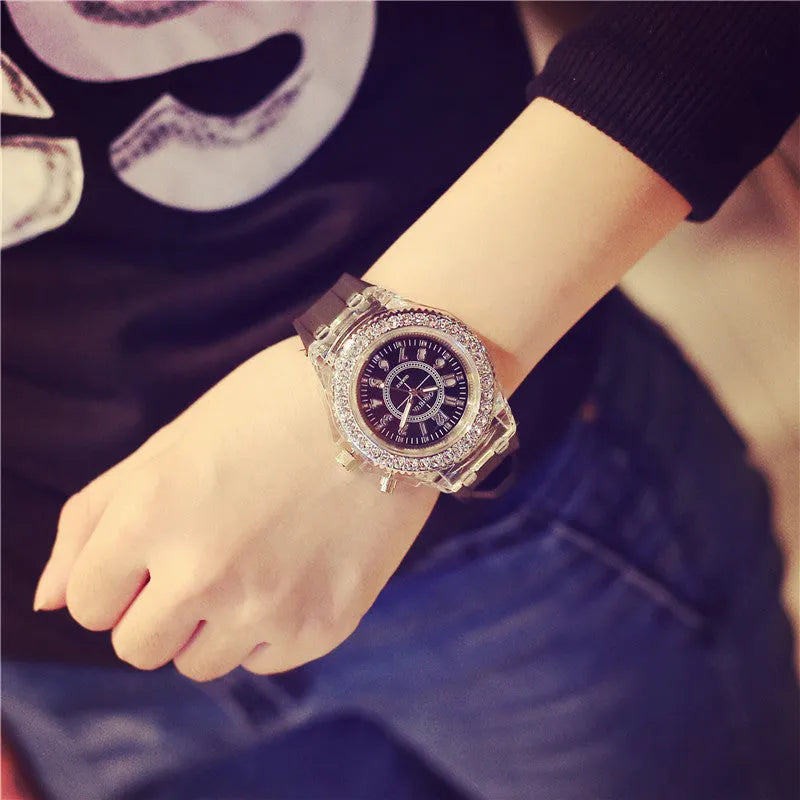 Women's LED luminous quartz watch with silicone strap and round alloy case on wrist