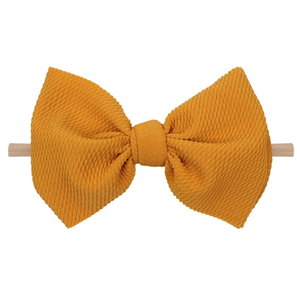 Children's waffle fabric bow hair accessory headband in multiple colour options