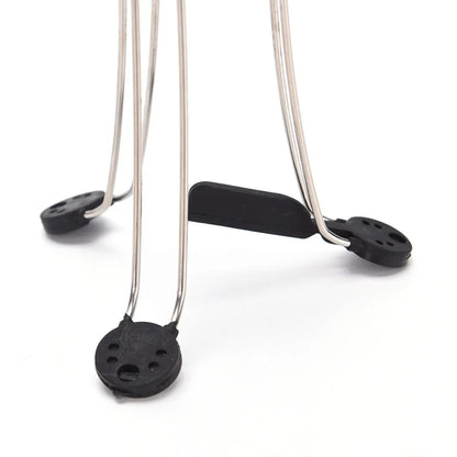 White and black wireless automatic kitchen stirrer with three-speed button, shown next to a saucepan.
