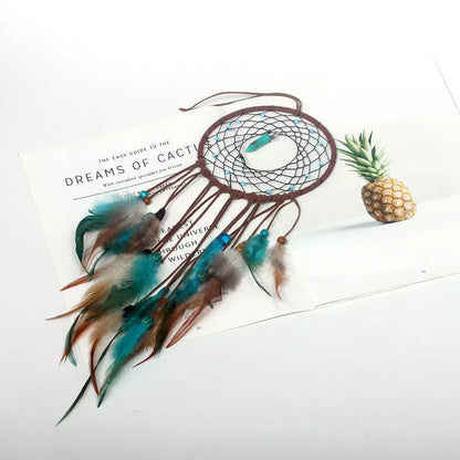 Handmade turquoise dream catcher with feathers and iron ring