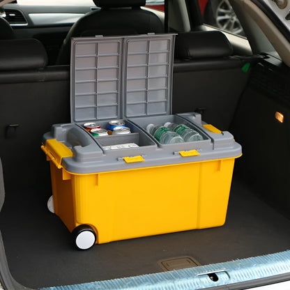 Large orange plastic storage box with black wheels and a pull-up handle, shown in a garage setting.