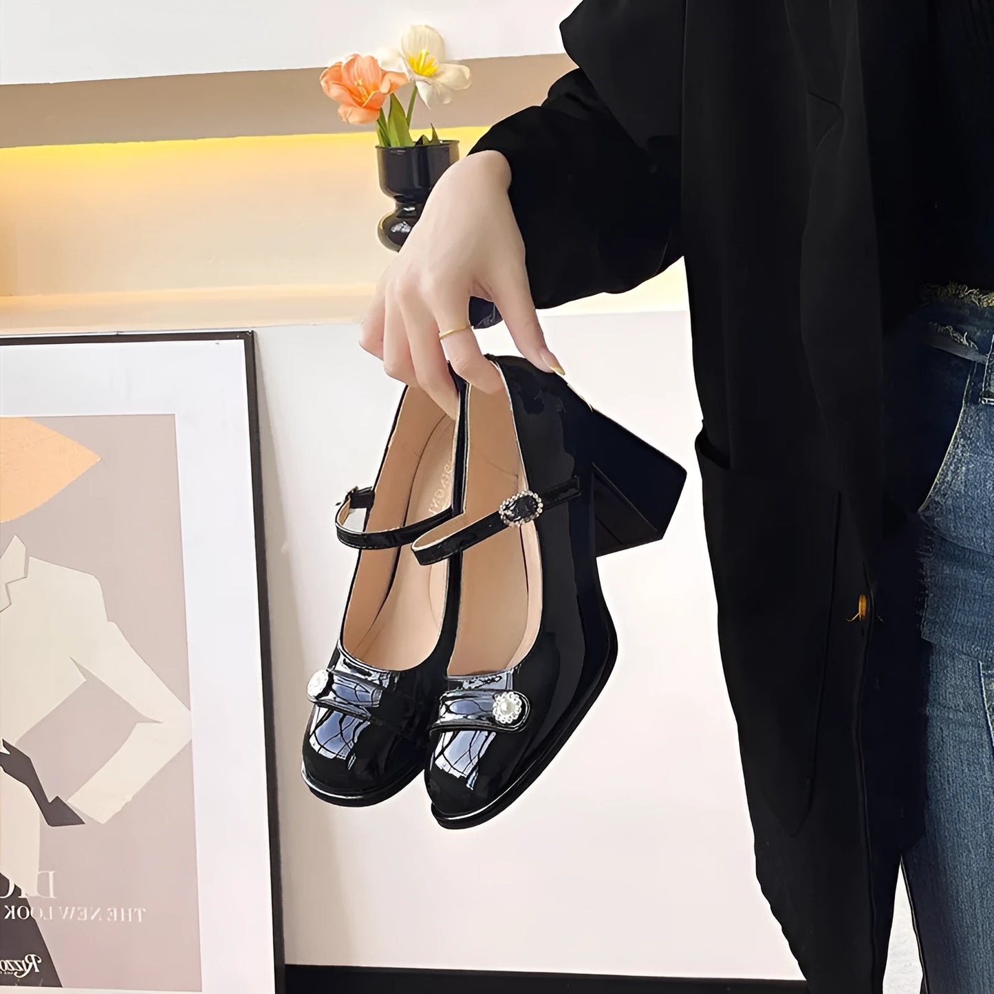Women's black patent leather wide fit high heels with a round toe and chunky block heel.