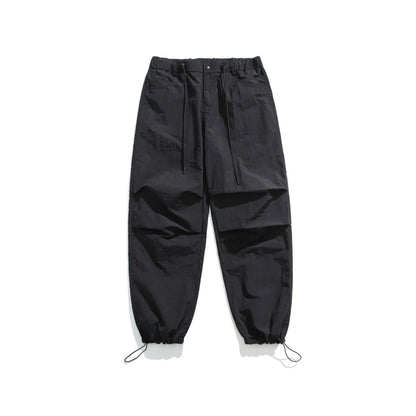 Men's loose straight-leg casual pants in thin ice silk fabric shown in black colour