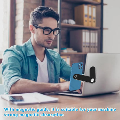 Black laptop phone holder with magnetic clip mounted on silver laptop, showing smartphone in adjustable bracket