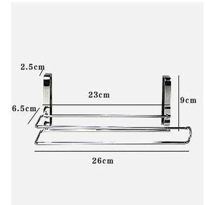 Silver stainless steel paper towel rack for hanging on the back of a kitchen cabinet door.