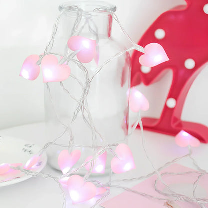 LED string lights with fabric heart elements in pink or blue colour options