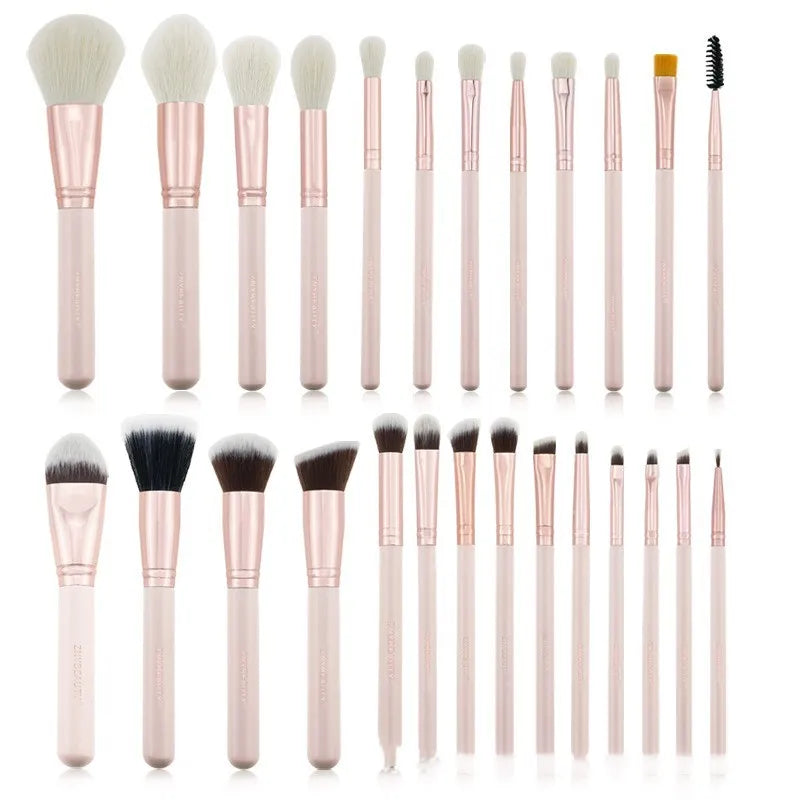 26 pink makeup brushes with wool bristles and wooden handles arranged in a PU zip bag.
