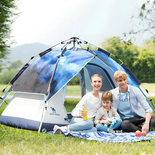 Automatic folding camping tent in blue set up on grass showing 220cm length and 120cm height