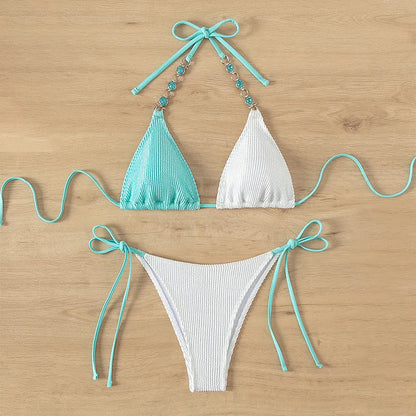 Colour-matched women's lace-up bikini with pearl chain detail on a sleeveless top and shorts.
