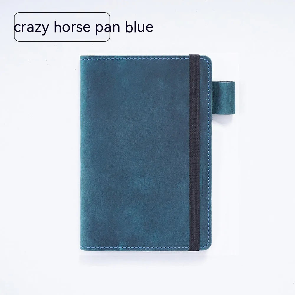 Handmade cowhide kraft notebook open showing wood-free paper, in dark green colour