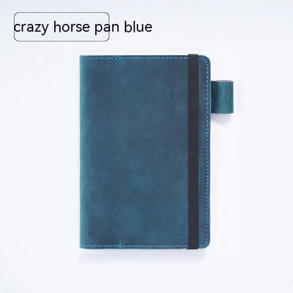 Handmade cowhide kraft notebook open showing wood-free paper, in dark green colour