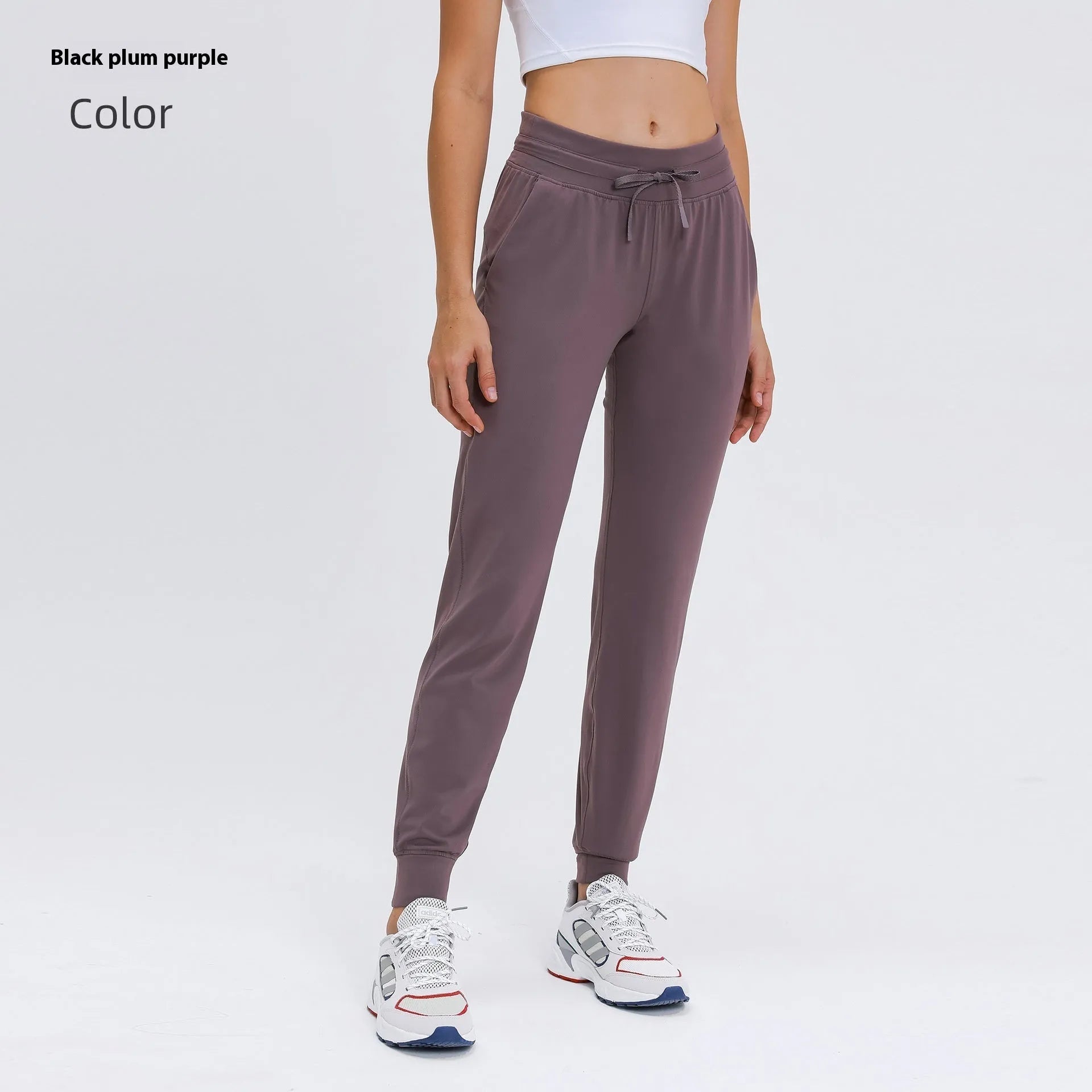 Women's high waist yoga pants with drawstring waistband in Belgian blue colour, showing stretch fabric during yoga pose