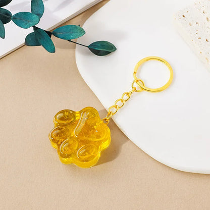 Natural crystal cat's paw keychain pendant showing gemstone options with integrated attachment loop