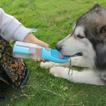 Multifunctional pet water bottle and feeder with poop dispenser in turquoise, pink, and white colors