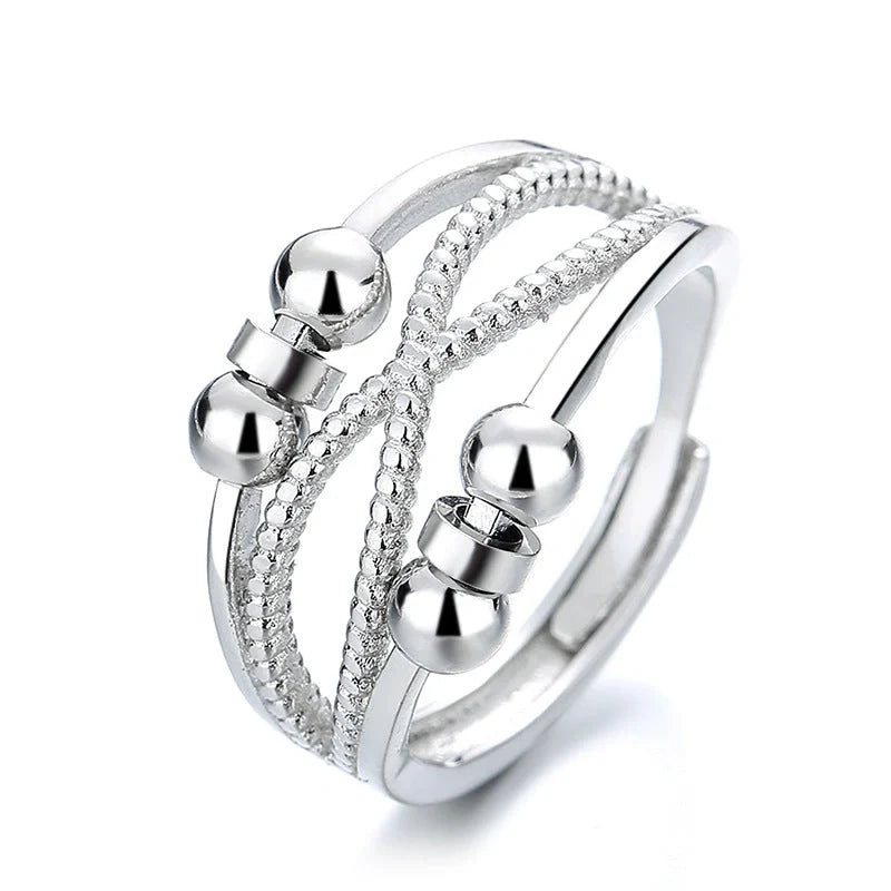 Adjustable rotatable anxiety relief ring for women with open design and platinum finish