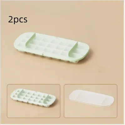 Yellow and blue food grade plastic ice cube trays with ice shovel stored in dedicated slot