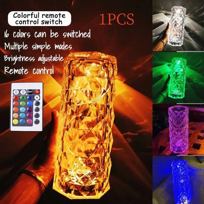 Modern minimalist acrylic crystal rose LED table lamp with touch switch on a wooden table.