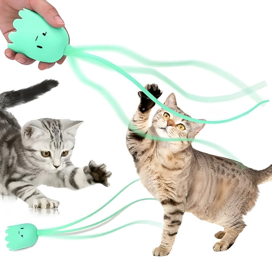 Green automatic electronic cat wand toy with silicone tails moving, placed on a carpet.