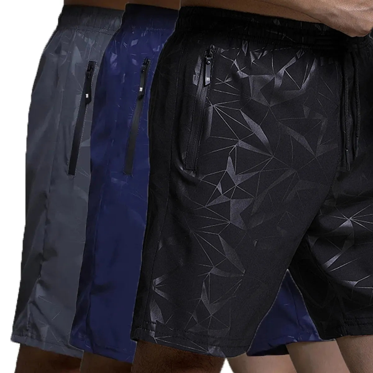 Men's loose-fit casual sports shorts in grey with a printed pattern, showing elastic waistband and fifth-pants length.
