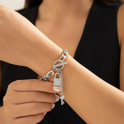Stylish lock and key pendant necklace with a delicate chain, available in a variety of colors and materials