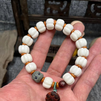 White Bodhi root bracelet with carved pumpkin lotus beads including Apple Orchard and Duobao styles
