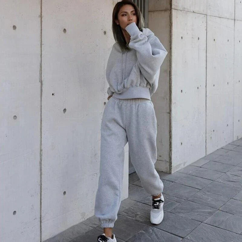 Women's casual hoodie outfit in various colors and sizes, featuring a stylish design and comfortable polyester construction.