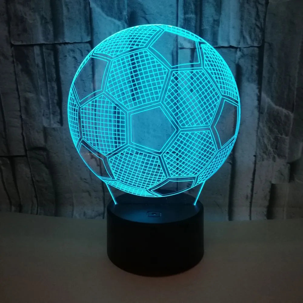 3D football-shaped LED night light showing colourful gradient illumination on a dark background