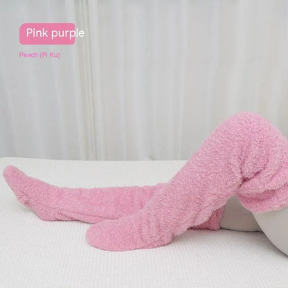 Cozy over-the-knee fuzzy socks in various colors, including brown, blue, dark gray, pink, silver, and more. Comfortable cotton design for warm, snug legs.