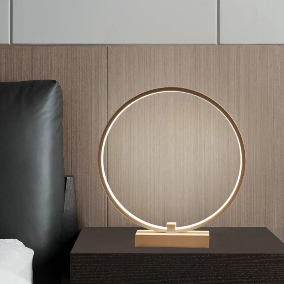 White circular LED bedside lamp with 25cm diameter on iron base showing warm white illumination