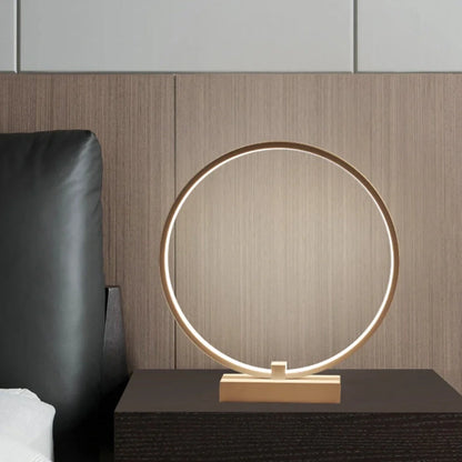 White circular LED bedside lamp with 25cm diameter on iron base showing warm white illumination