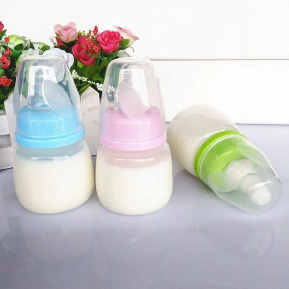 60ml infant feeding bottle with variable flow nipple in blue, green, or pink colour options