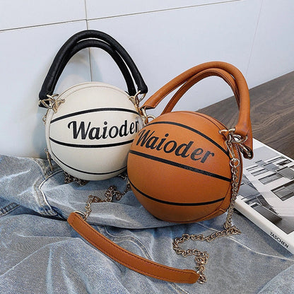 Basketball-shaped handbag with adjustable shoulder strap in pink, white, black, and brown