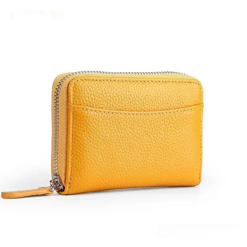 Genuine leather men's and women's zipper coin storage purse in black with sewing line detail.