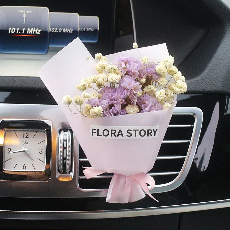 Mini dried flower bouquet mounted in car air vent for decorative aromatherapy