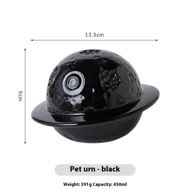 Handmade ceramic cinerary casket with cosmic starry sky design and cat-dog motifs in multiple colours