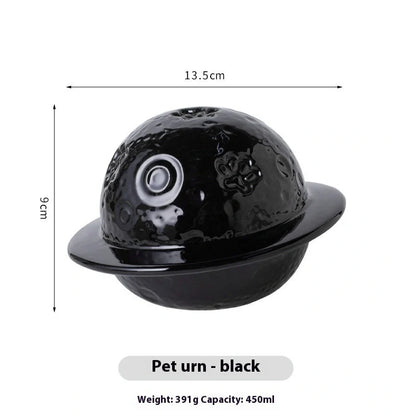 Handmade ceramic cinerary casket with cosmic starry sky design and cat-dog motifs in multiple colours