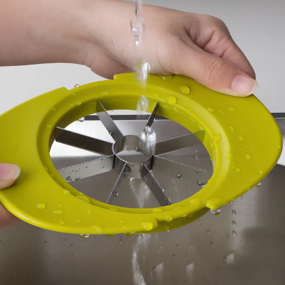 Green three-function fruit slicer for apples, tomatoes, and mangoes measuring 18.3cm