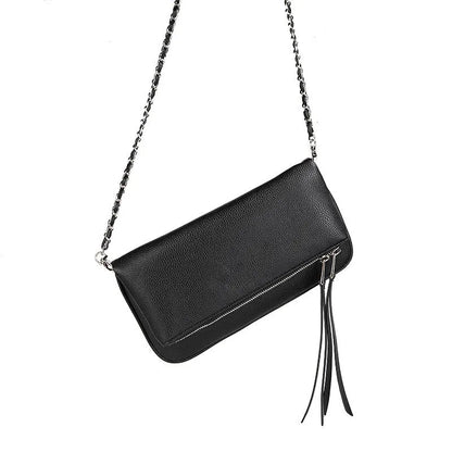 Soft black PU leather women's clutch bag with a gold chain strap, shown held and worn cross-body.