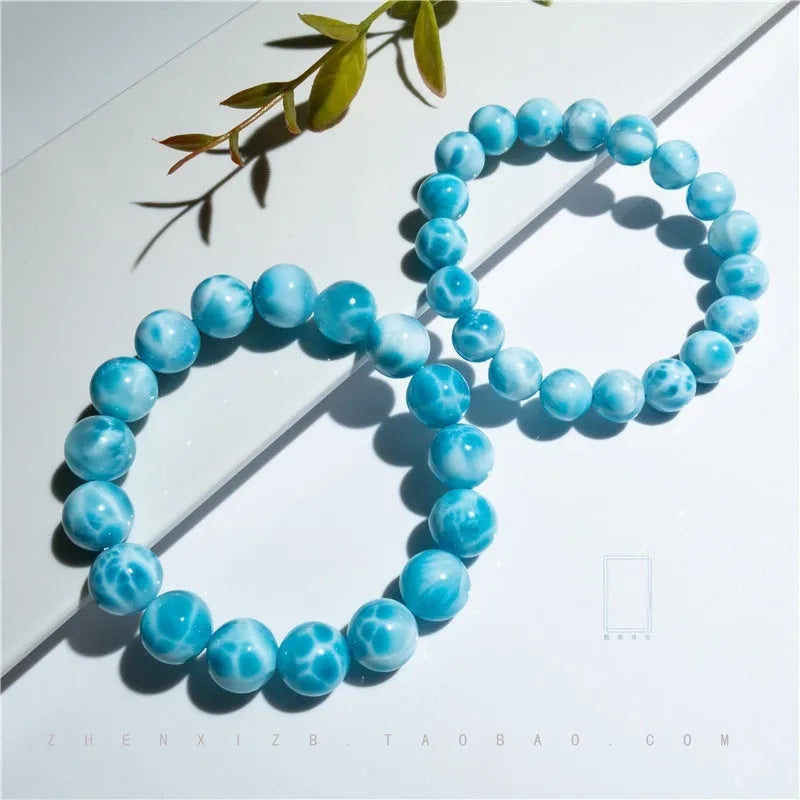 Blue bodhi bracelet with pearl accents showing bead sizes from 6mm to 14mm in Maillard style design