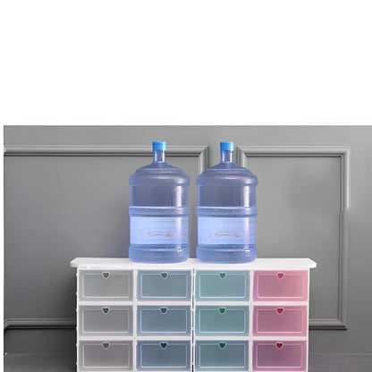 Transparent plastic shoe box showing stackable design and clear construction