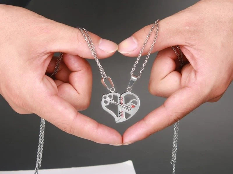 Elegant stainless steel love pendant necklace set for couples, perfect Valentine's gift.