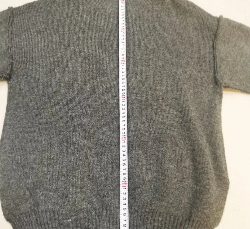 Women's acrylic side-slit sweater suit in dark grey, featuring a top and trousers for a coordinated two-piece set.