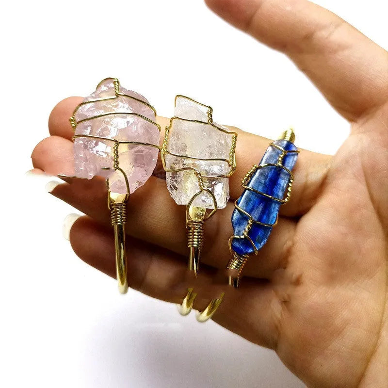 Unshaped natural crystal rough stone bracelet with gold winding metal accents in geometric design