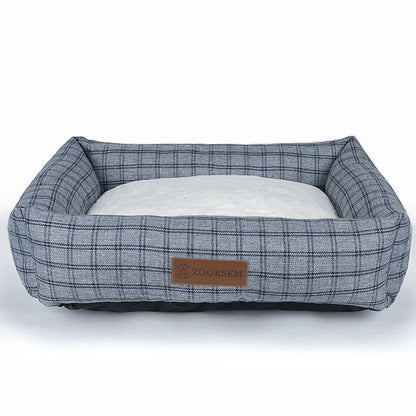 Grey linen fabric square dog bed measuring 60x50cm on a wooden floor