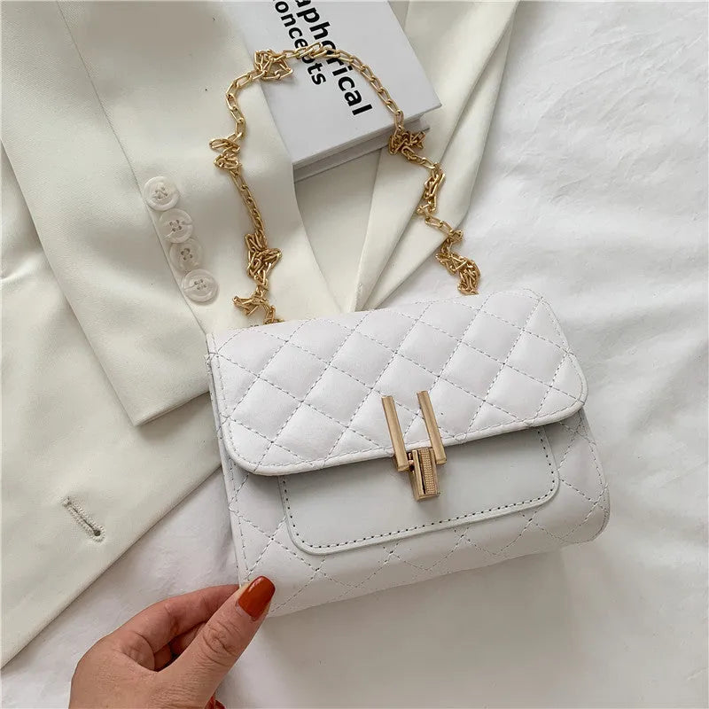 Women's solid colour PU leather crossbody bag with diamond lattice chain strap in black, green, or white.