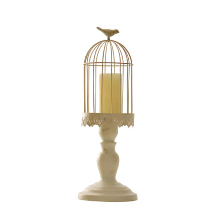 Iron candle holder with birdcage design measuring 37cm height and carved glass version at 33cm