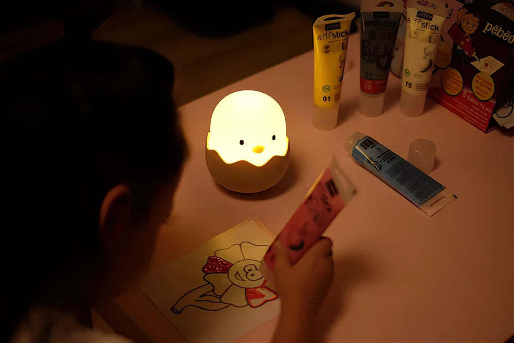 White egg shell chicken night light measuring 10.4cm with USB charging port and warm illumination