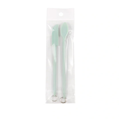 Retractable silicone cosmetic spatula extended to 15cm with scraper tool for product application