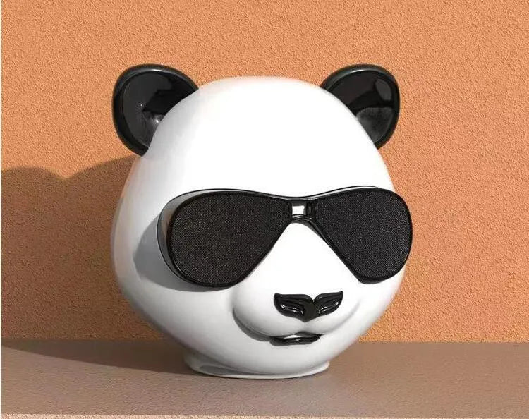 Portable mini Bluetooth speaker with classic style design, showing USB port and approximate 8cm diameter size