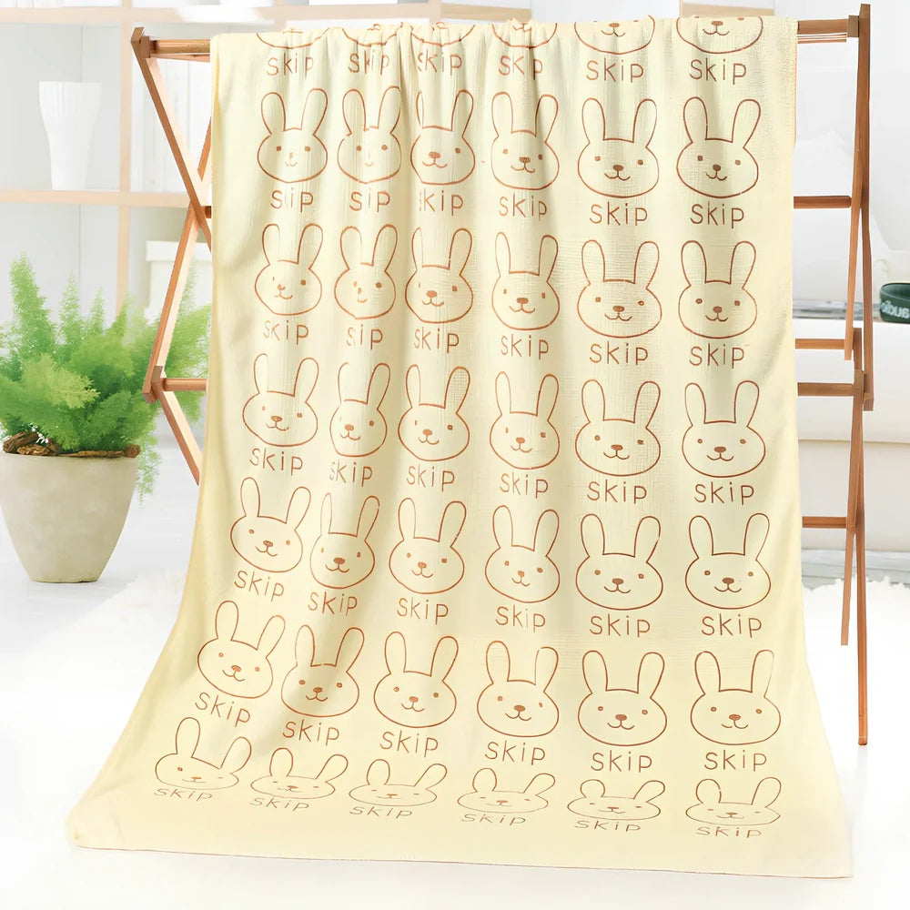 Microfiber bath towel with cartoon character print measuring 70cm wide by 140cm long